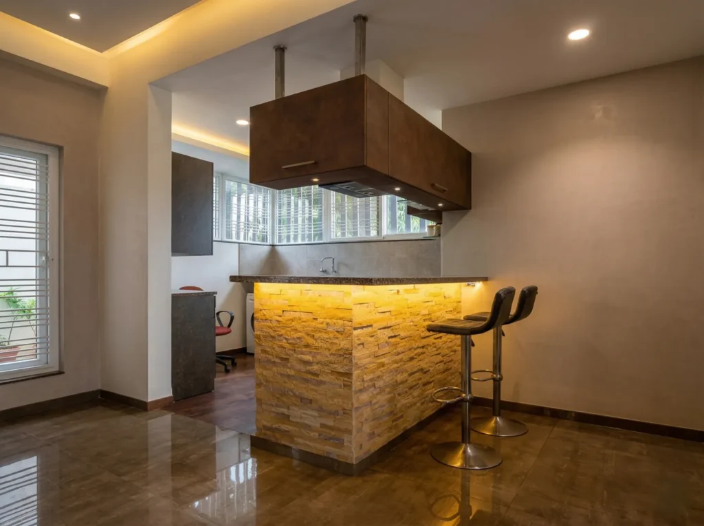 Modern residential kitchen with backlit stone island counter and suspended overhead cabinet — home construction in Bangalore.