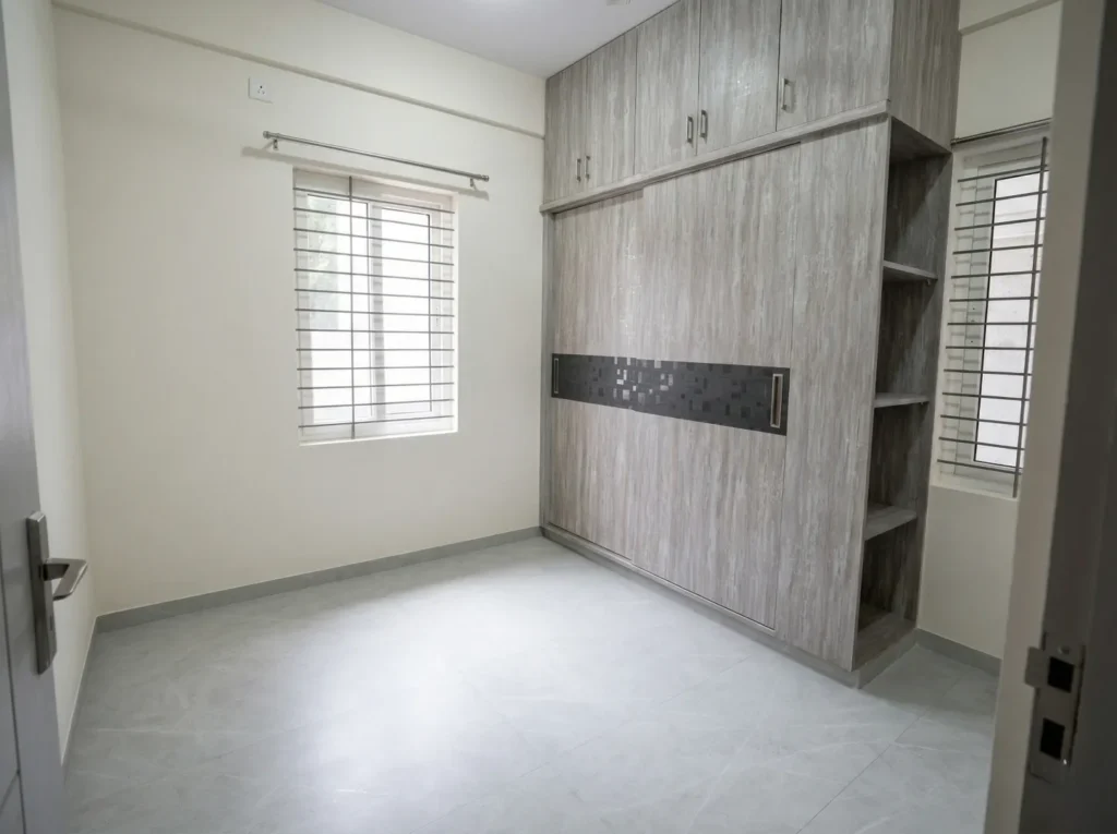 Spacious master bedroom with a full-height wooden sliding wardrobe, integrated loft storage, and natural lighting.