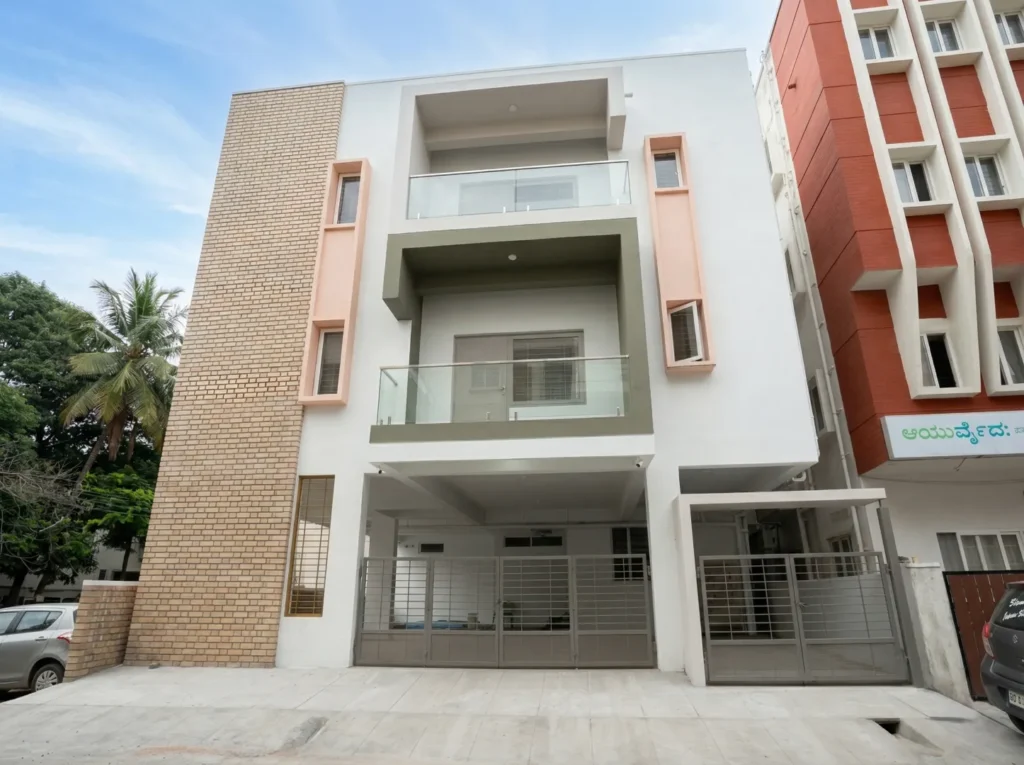 Modern residential building elevation with brick cladding accents, cantilevered balconies, and premium glass railings.