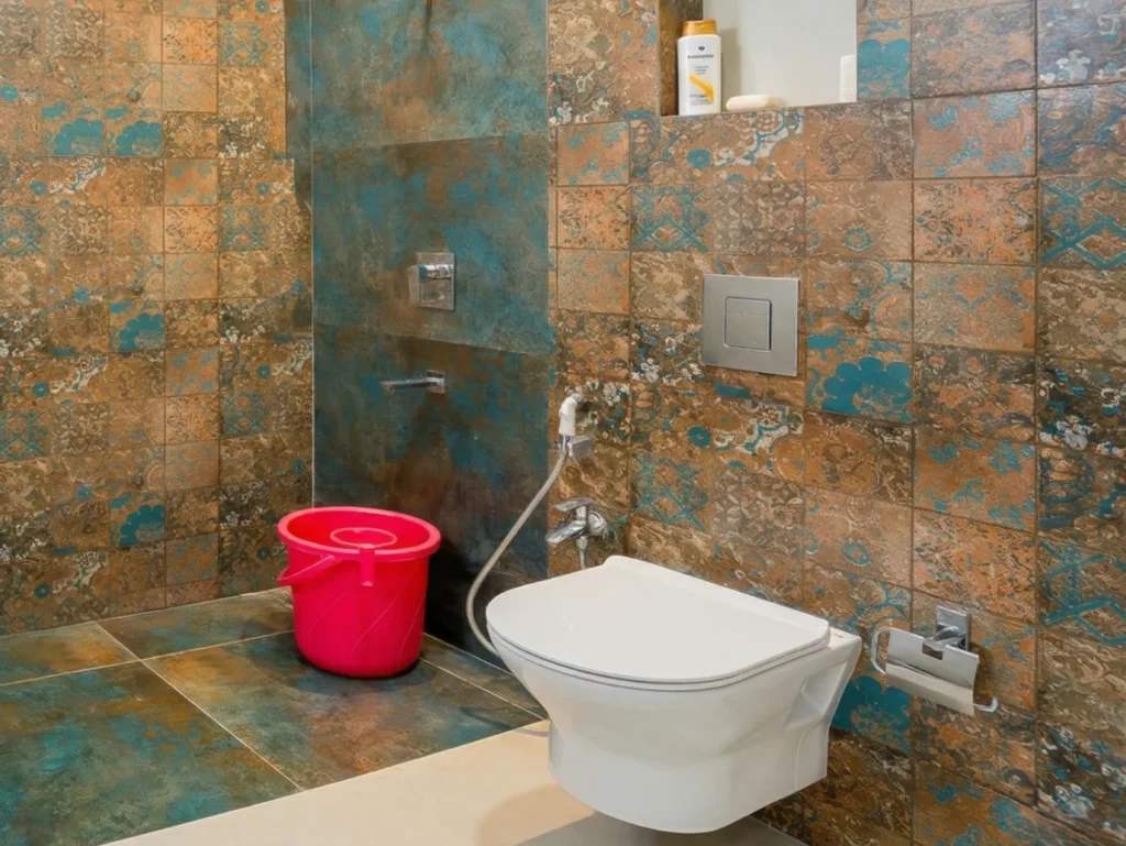 Modern bathroom featuring rustic textured wall tiles designed by a home construction company.