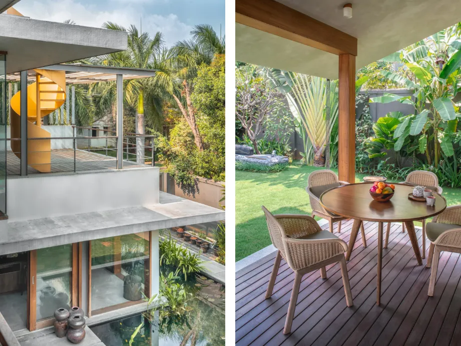 Residential upper terrace with yellow spiral staircase and garden deck dining area surrounded by tropical planting in a Bangalore home construction by High Tech Constructions