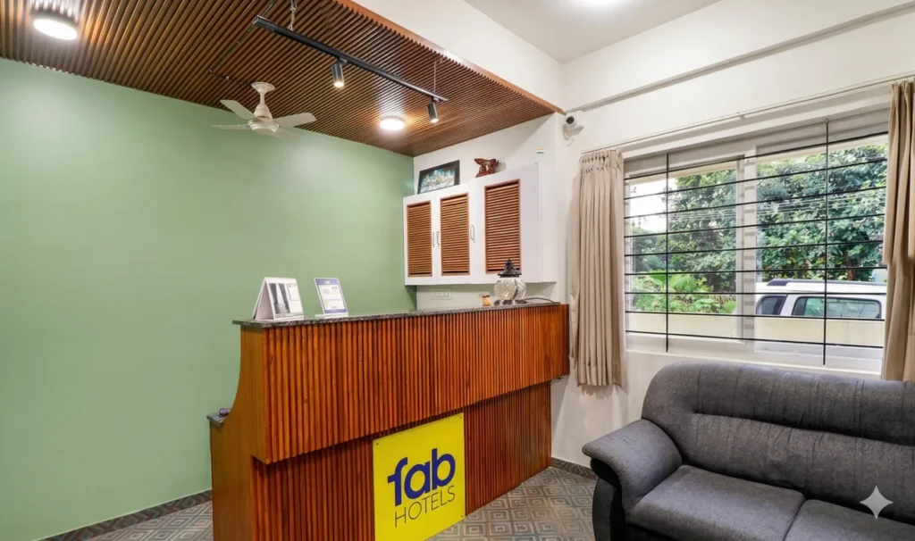 Modern lobby interior featuring wood slat ceilings and a reception desk by a residential construction company.