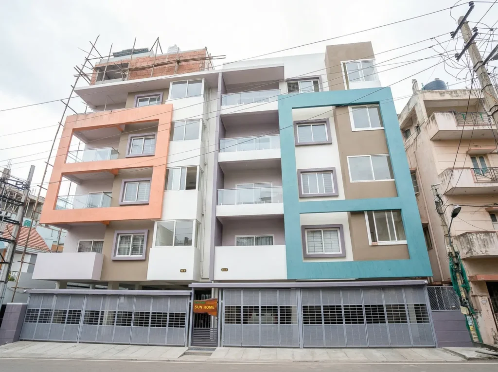 Modern multi-story apartment elevation by High Tech Constructions, a leading construction company.